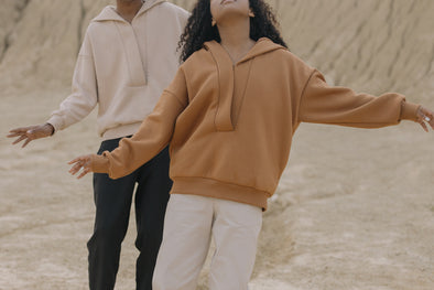 A man and woman wearing casual fall outfits